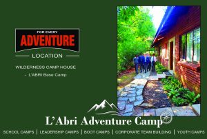 School students walking along the stone pathway outside Wilderness Camp House accommodation at L'Abri