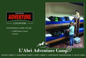 Campers unpacking bags in the Wilderness Camp House dormitory bunk rooms at L'Abri